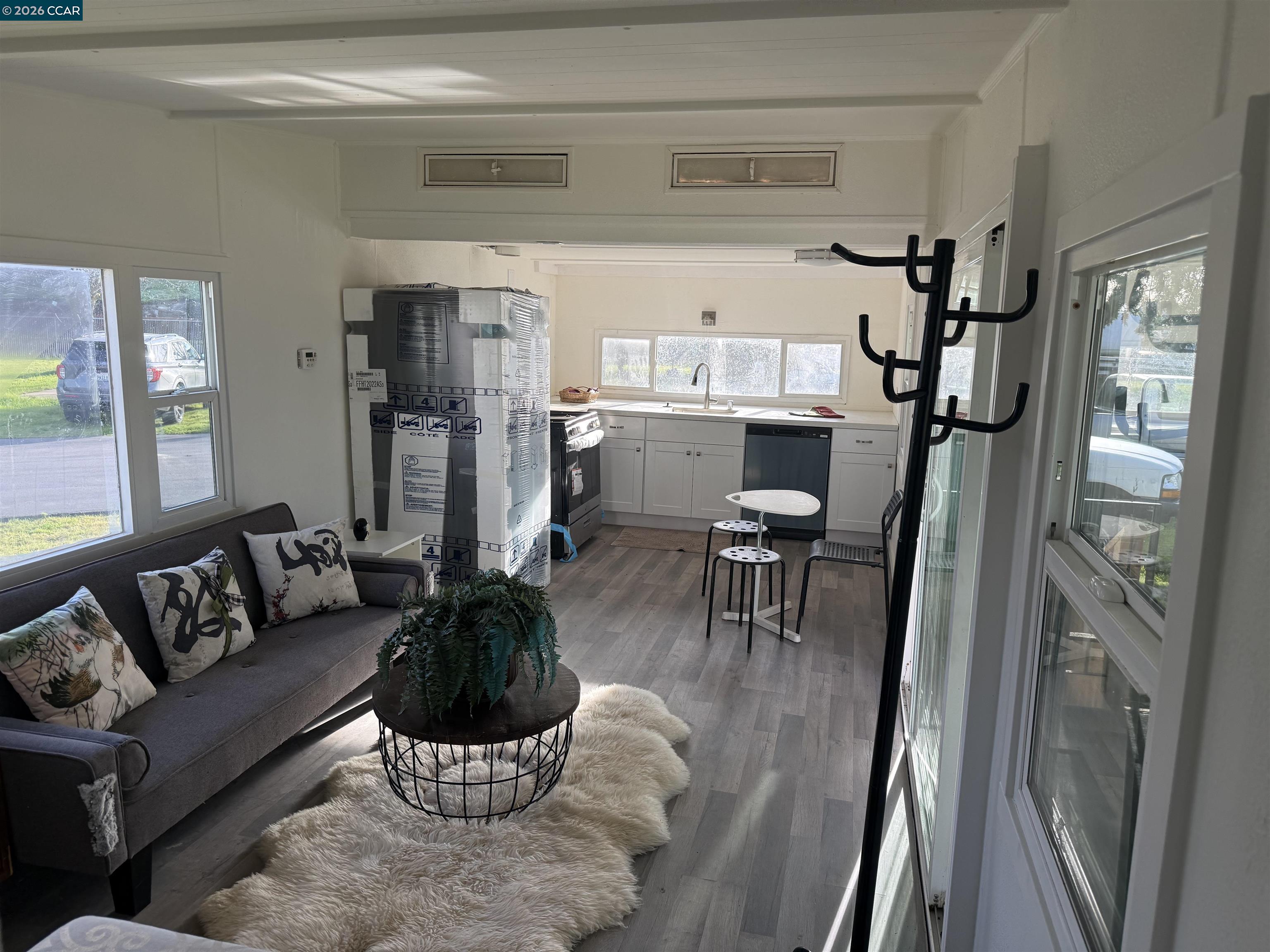3505 Gateway Road, Unit 13M Bethel Island, CA 94511 - Photo 14 of 17 a living room with furniture and a dining table