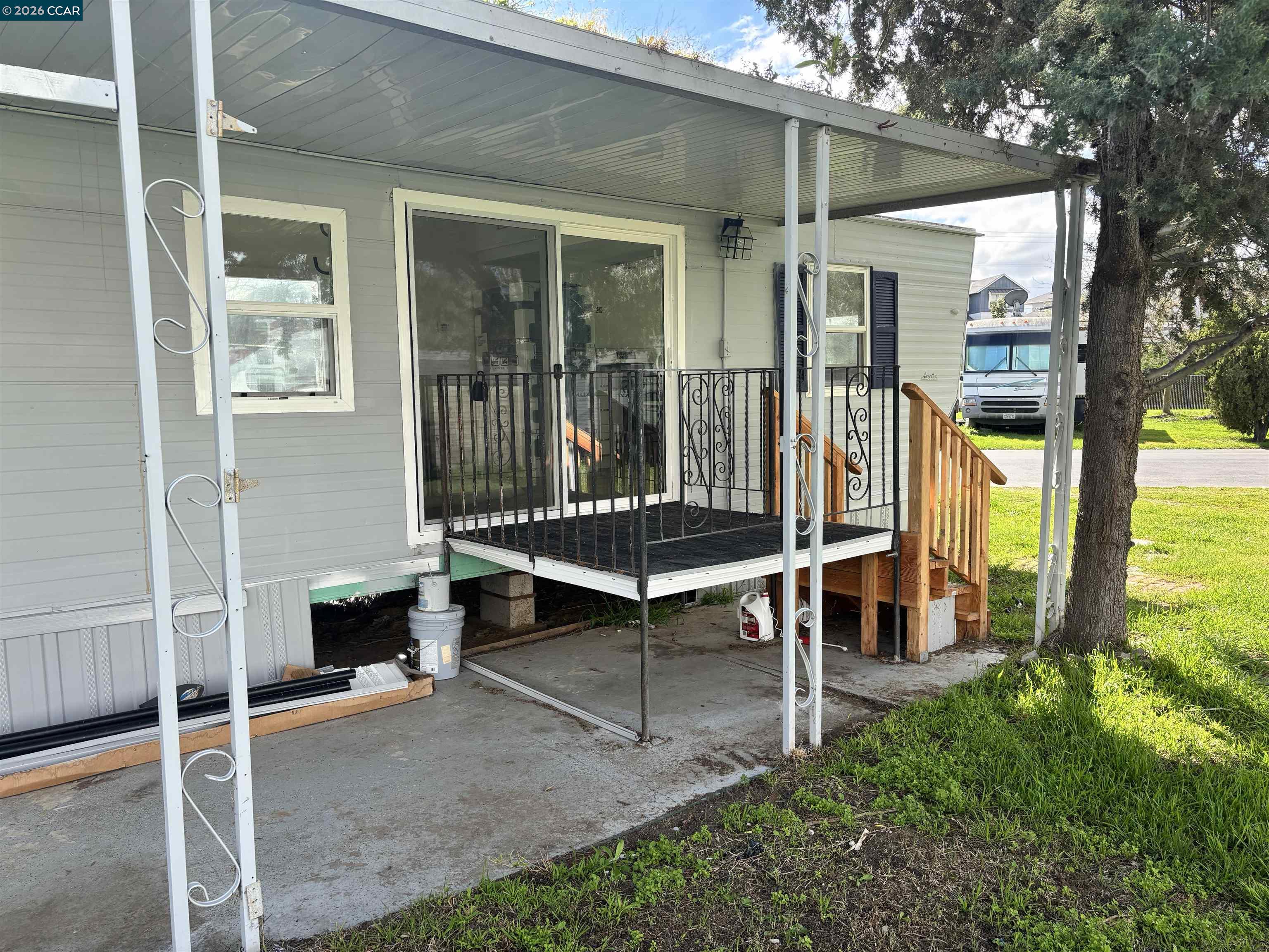 3505 Gateway Road, Unit 13M Bethel Island, CA 94511 - Photo 16 of 17 a blue bench sitting in front of a building