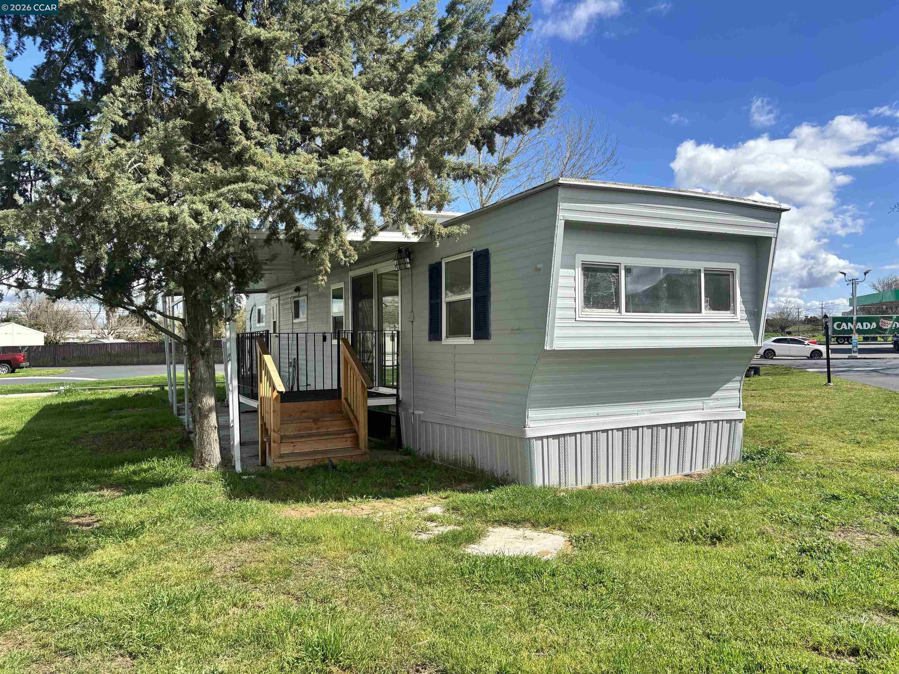 3505 Gateway Road, Unit 13M Bethel Island, CA 94511 - Photo 2 of 17 a view of a house with a yard