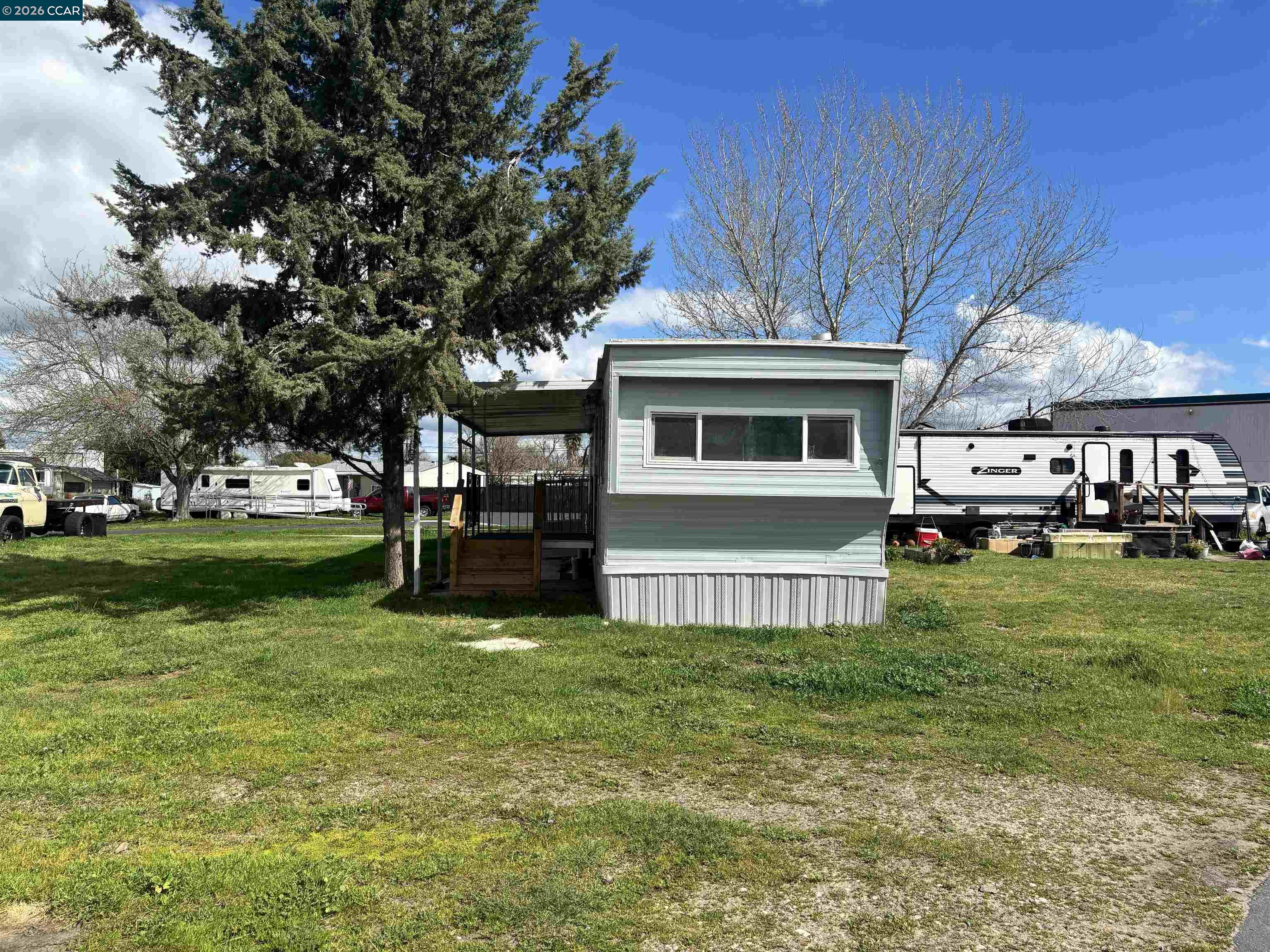 3505 Gateway Road, Unit 13M Bethel Island, CA 94511 - Photo 4 of 17 a view of a house with a yard