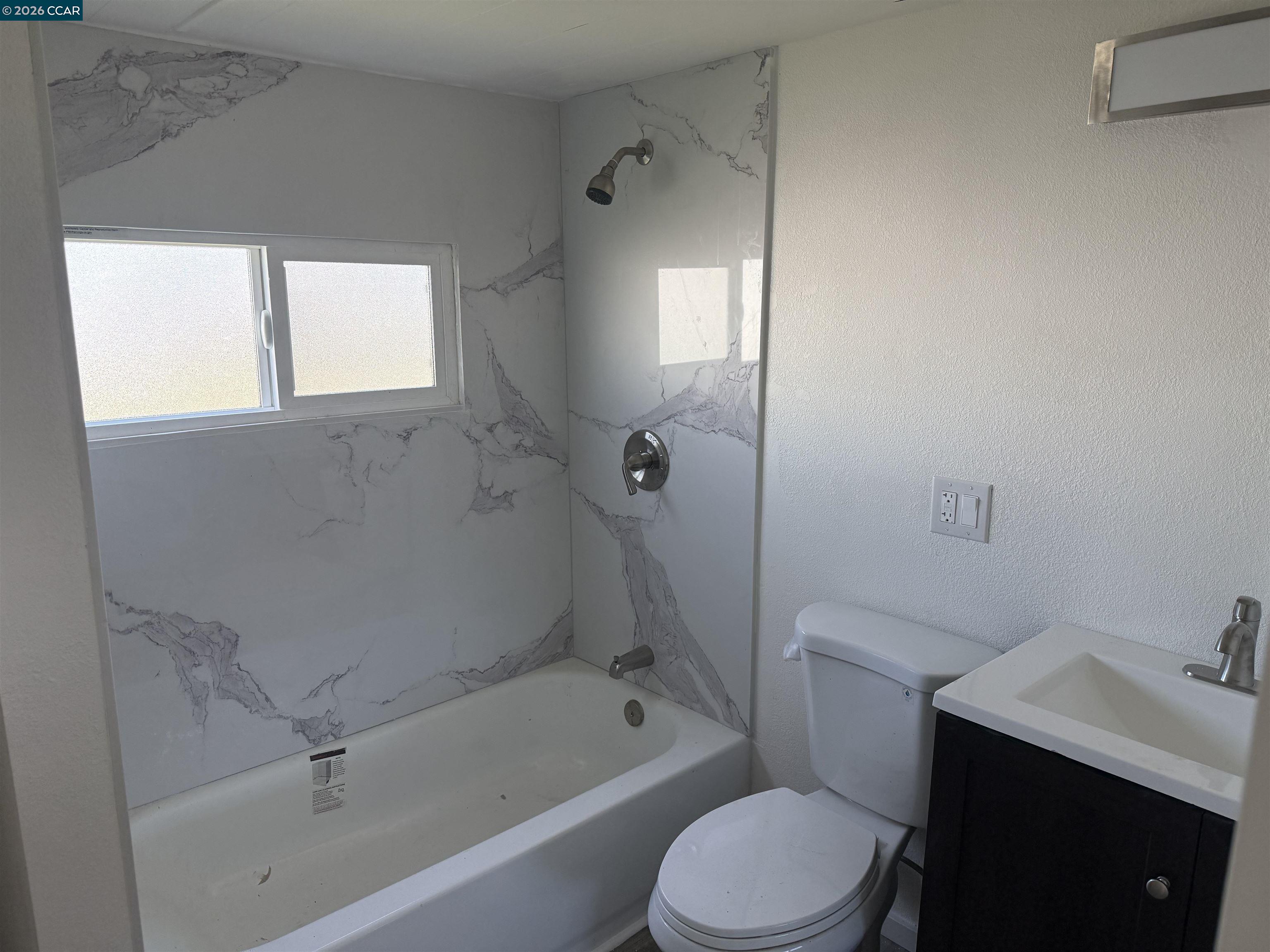 3505 Gateway Road, Unit 13M Bethel Island, CA 94511 - Photo 7 of 17 a bathroom with a toilet a sink and bathtub