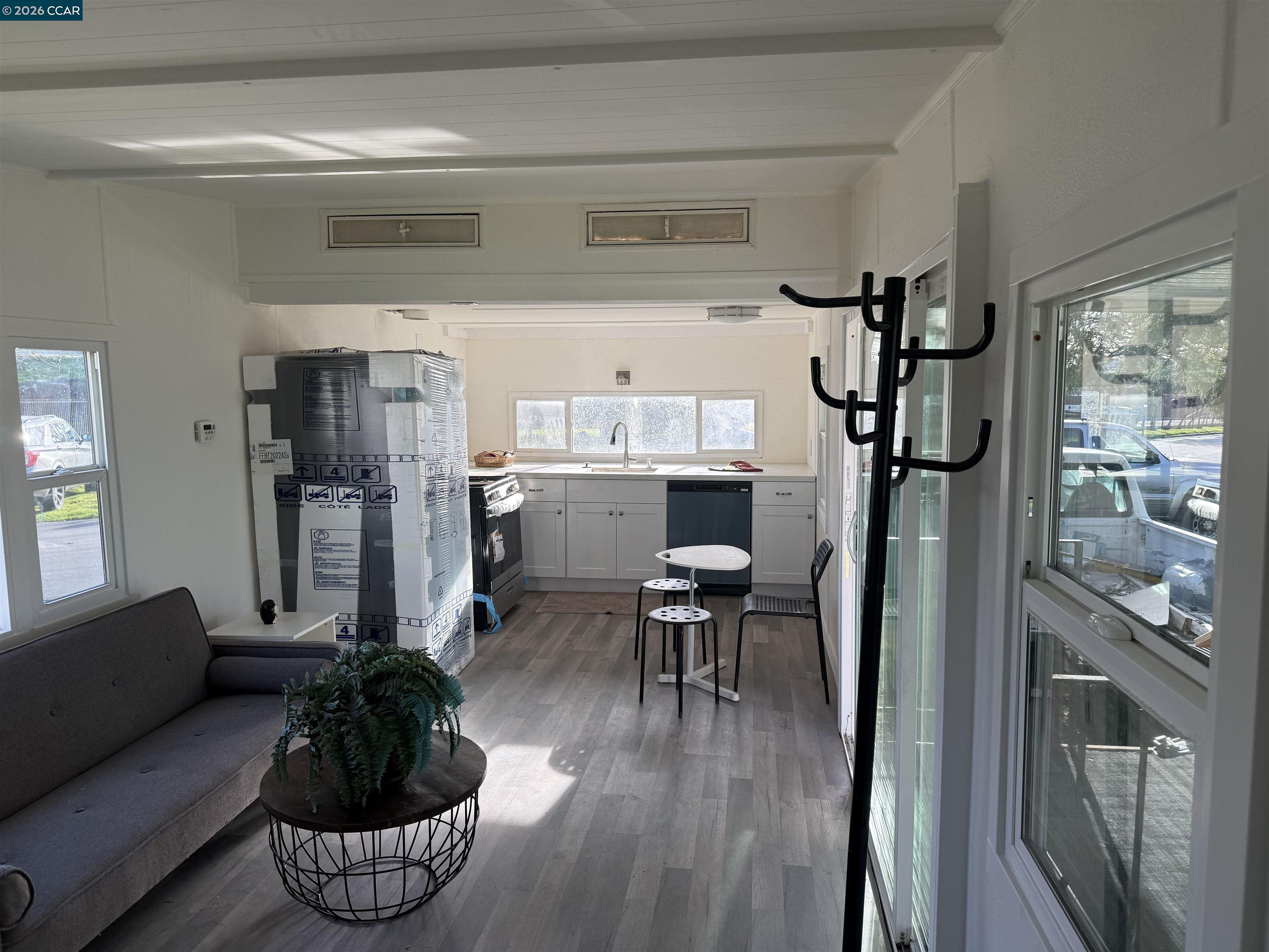 3505 Gateway Road, Unit 13M Bethel Island, CA 94511 - Photo 10 of 17 a living room with furniture and a wooden floor