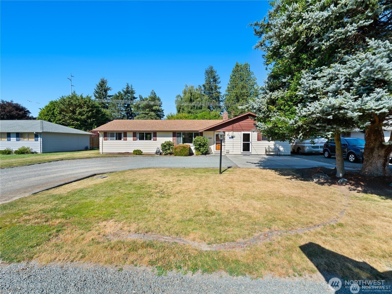 1205 South Walnut Street Burlington, WA 98233 - Photo 1 of 40 a house view with a swimming pool
