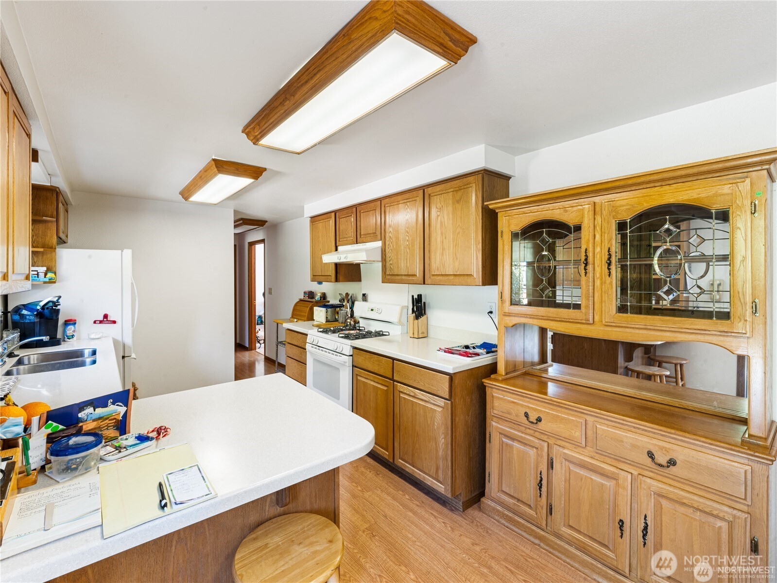 1205 South Walnut Street Burlington, WA 98233 - Photo 14 of 40 a kitchen with a sink stove and cabinets