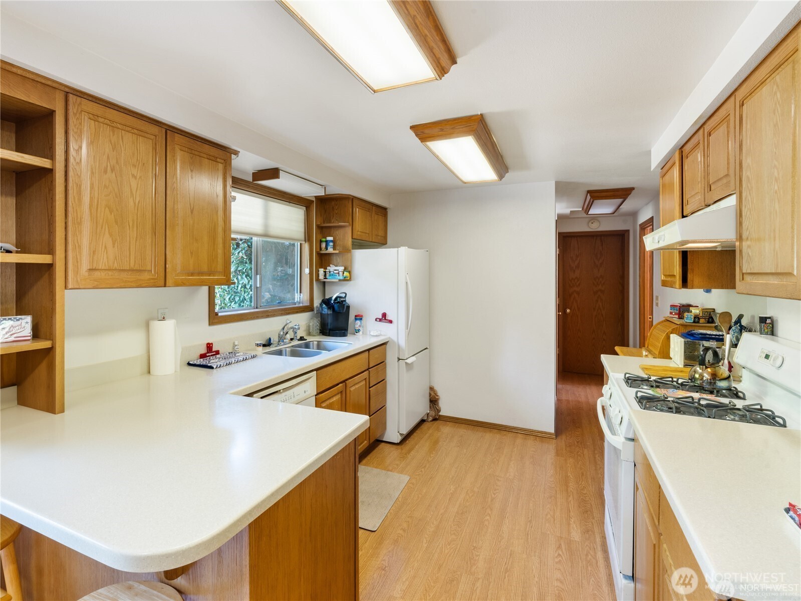 1205 South Walnut Street Burlington, WA 98233 - Photo 15 of 40 a kitchen with a sink a stove and a refrigerator
