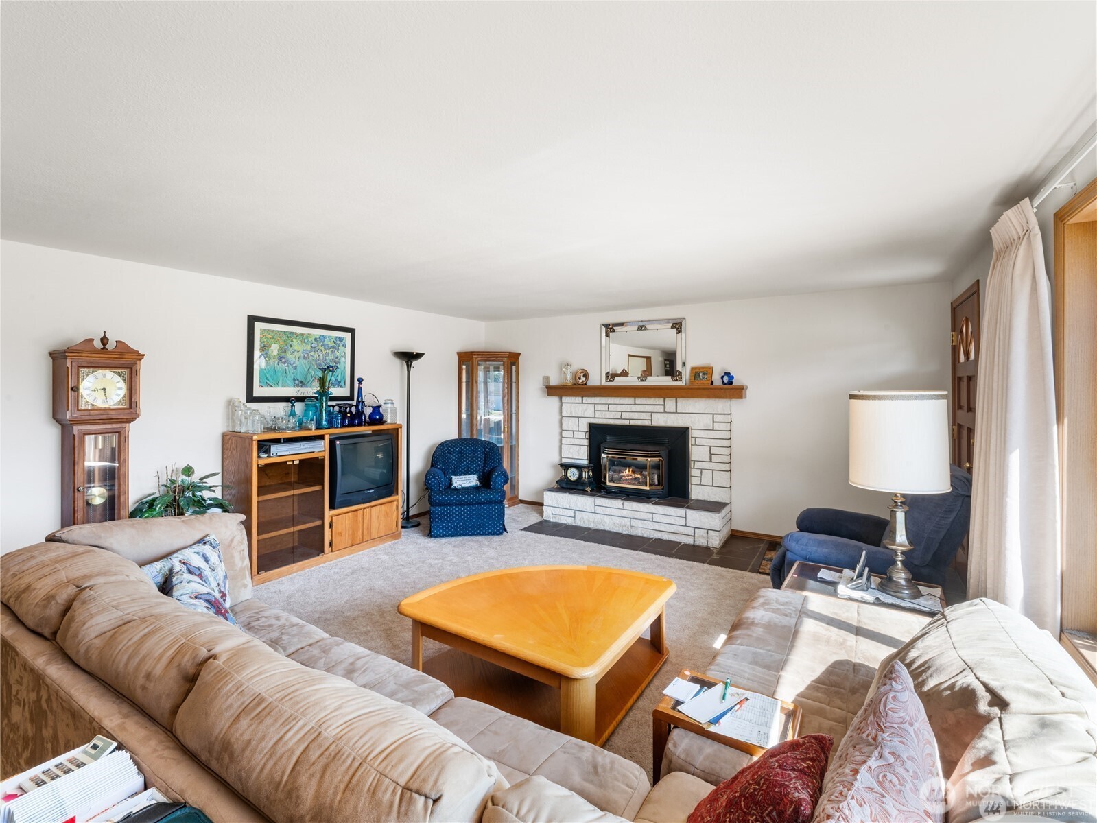 1205 South Walnut Street Burlington, WA 98233 - Photo 17 of 40 a living room with furniture and a fireplace