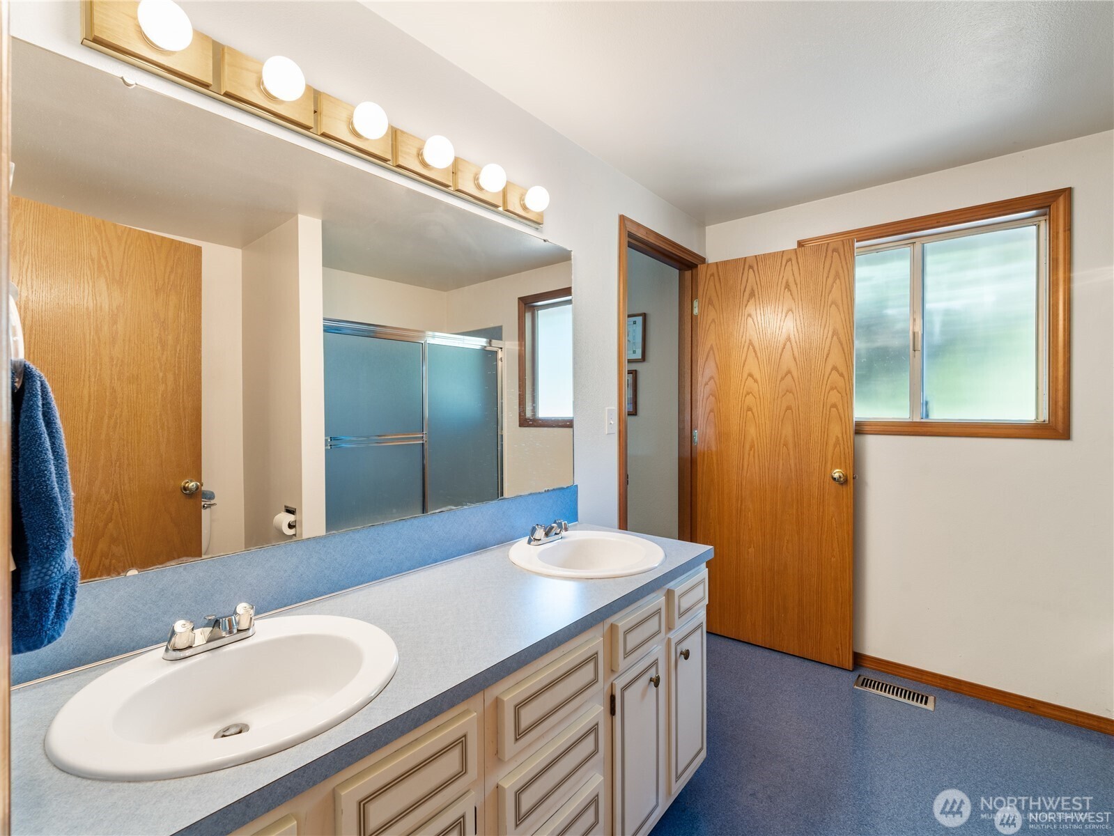 1205 South Walnut Street Burlington, WA 98233 - Photo 24 of 40 a bathroom with a sink and a mirror