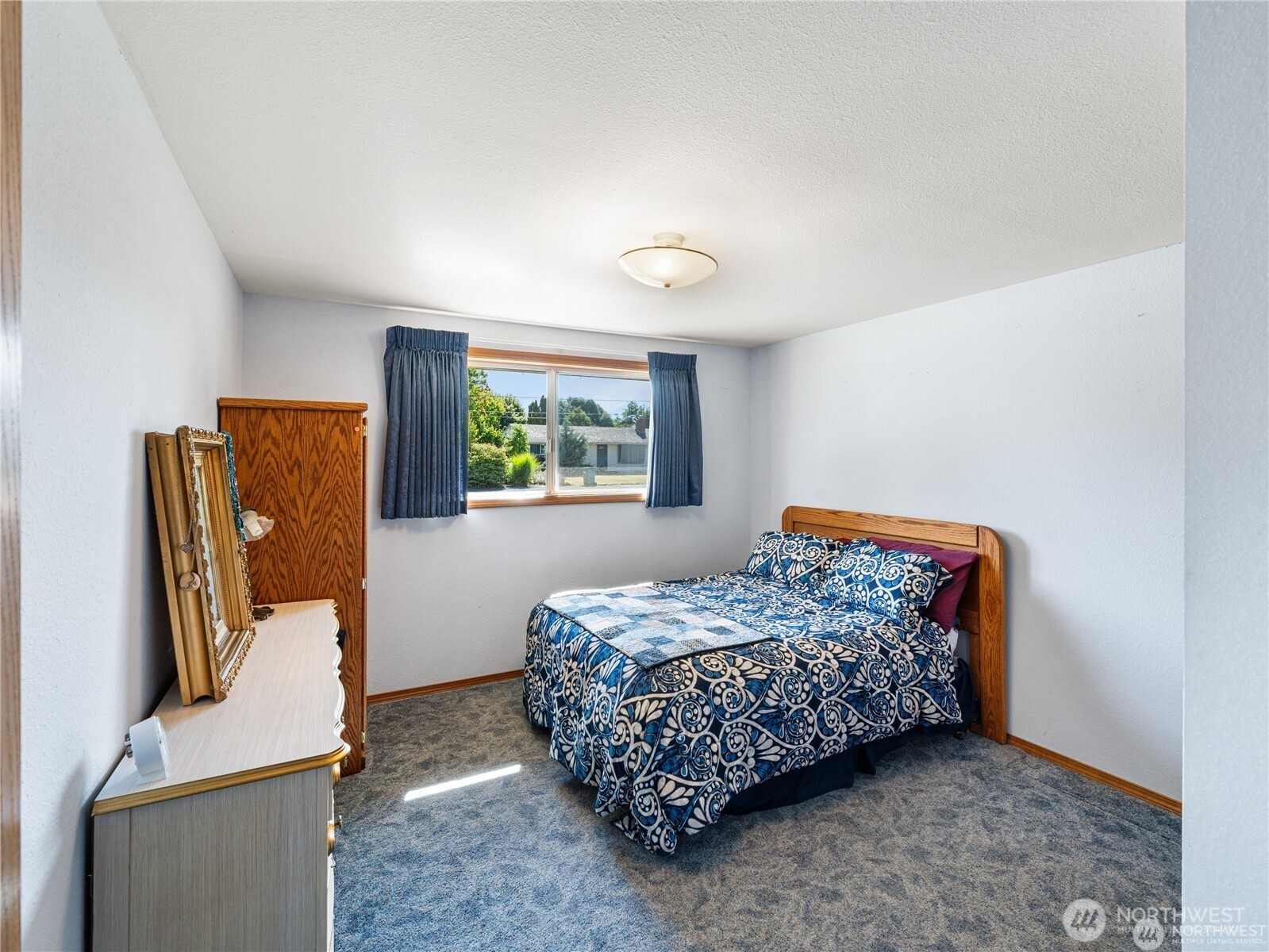 1205 South Walnut Street Burlington, WA 98233 - Photo 26 of 40 a bedroom with a bed and furniture