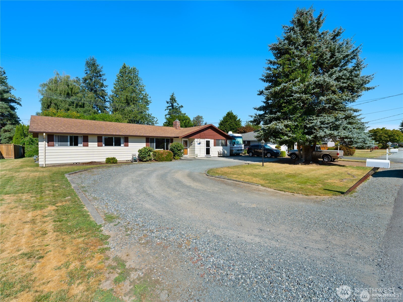 1205 South Walnut Street Burlington, WA 98233 - Photo 3 of 40 a view of swimming pool with outdoor seating and house in the background