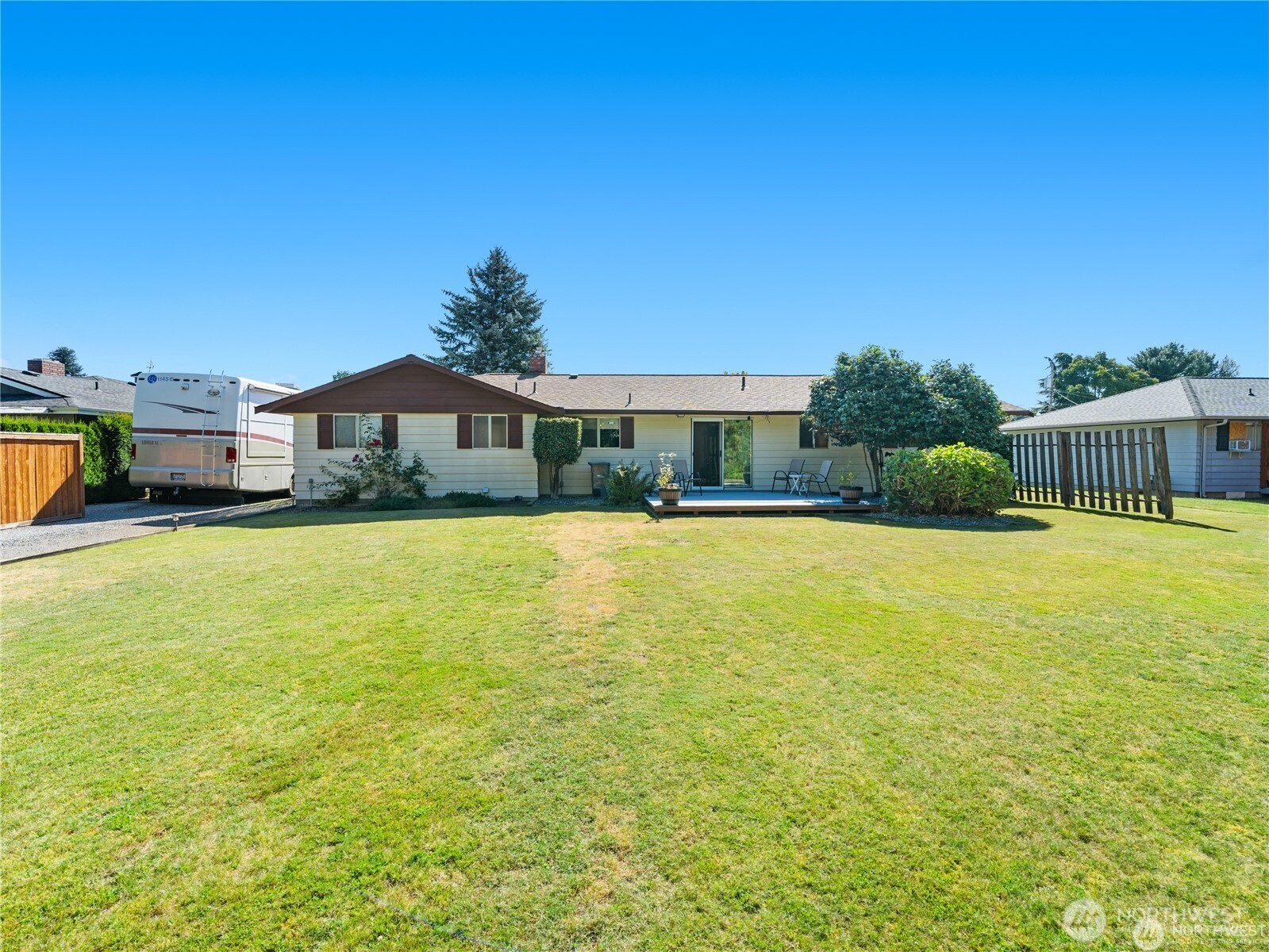 1205 South Walnut Street Burlington, WA 98233 - Photo 7 of 40 a house view with swimming pool and trees in the background