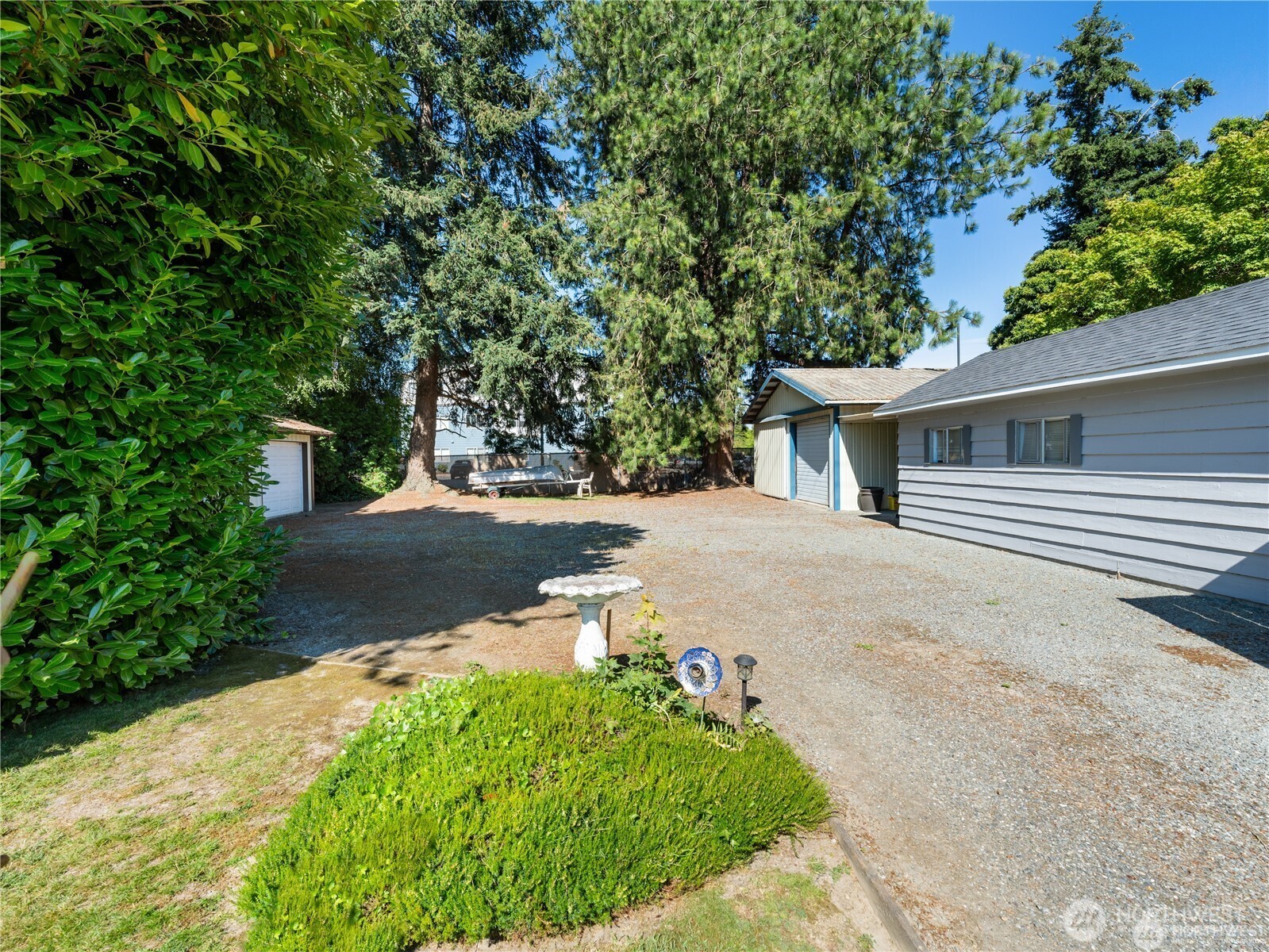 1205 South Walnut Street Burlington, WA 98233 - Photo 8 of 40 a backyard of a house with lots of green space