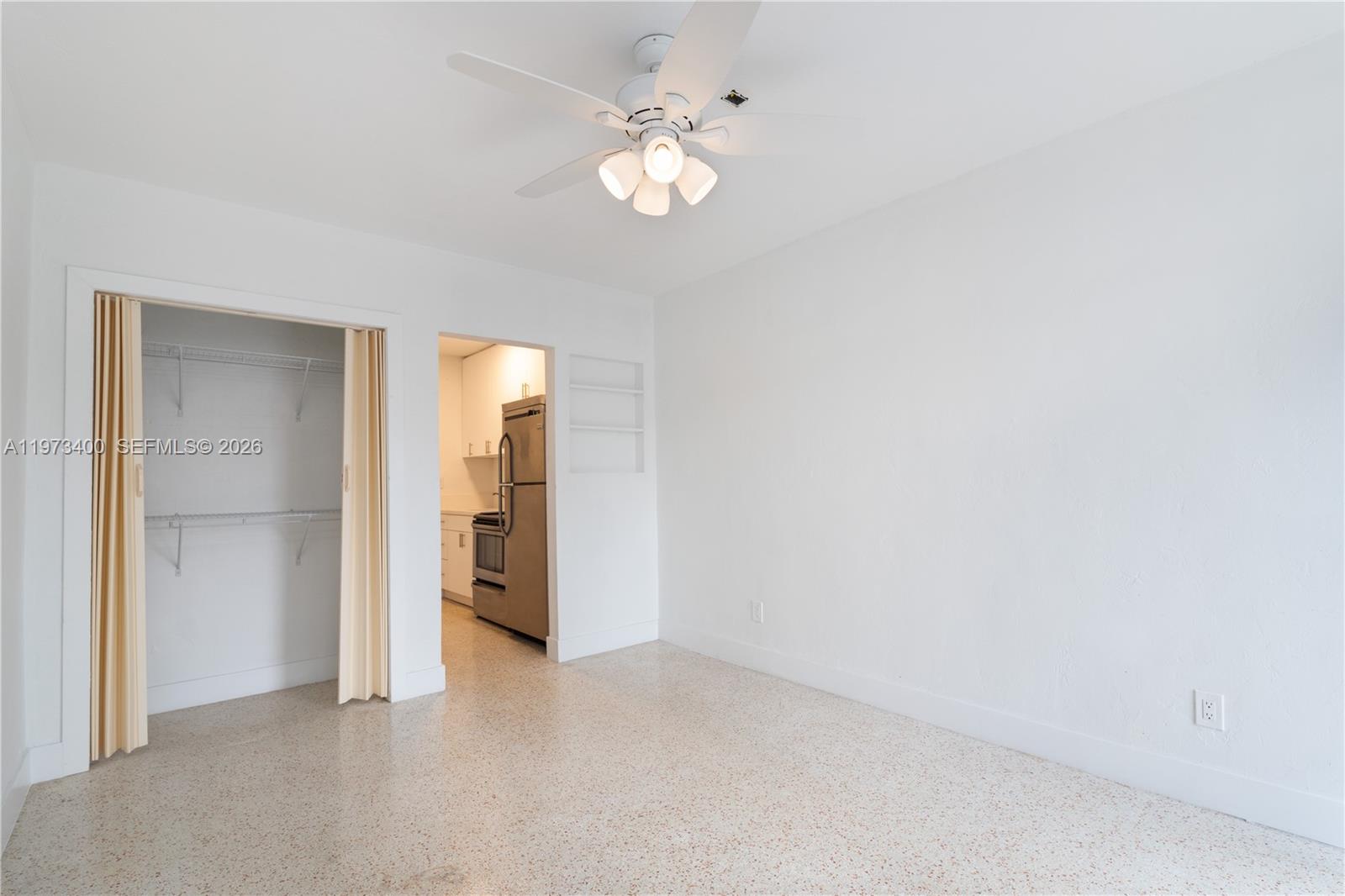 1450 Southwest 6th Street, Unit 2 Miami, FL 33135 - Photo 2 of 12 a view of an empty room with a window