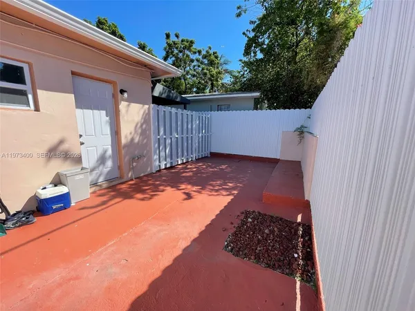a view of a backyard of the house