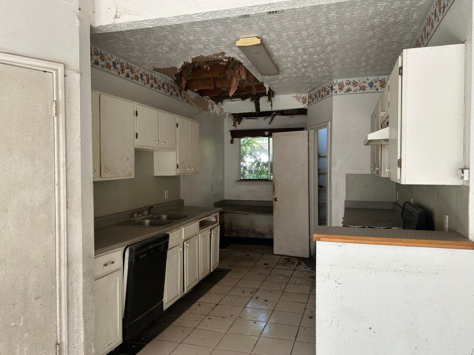 3838 Buckhurst Drive Houston, TX 77066 - Photo 13 of 21 a kitchen with a stove a refrigerator and a sink