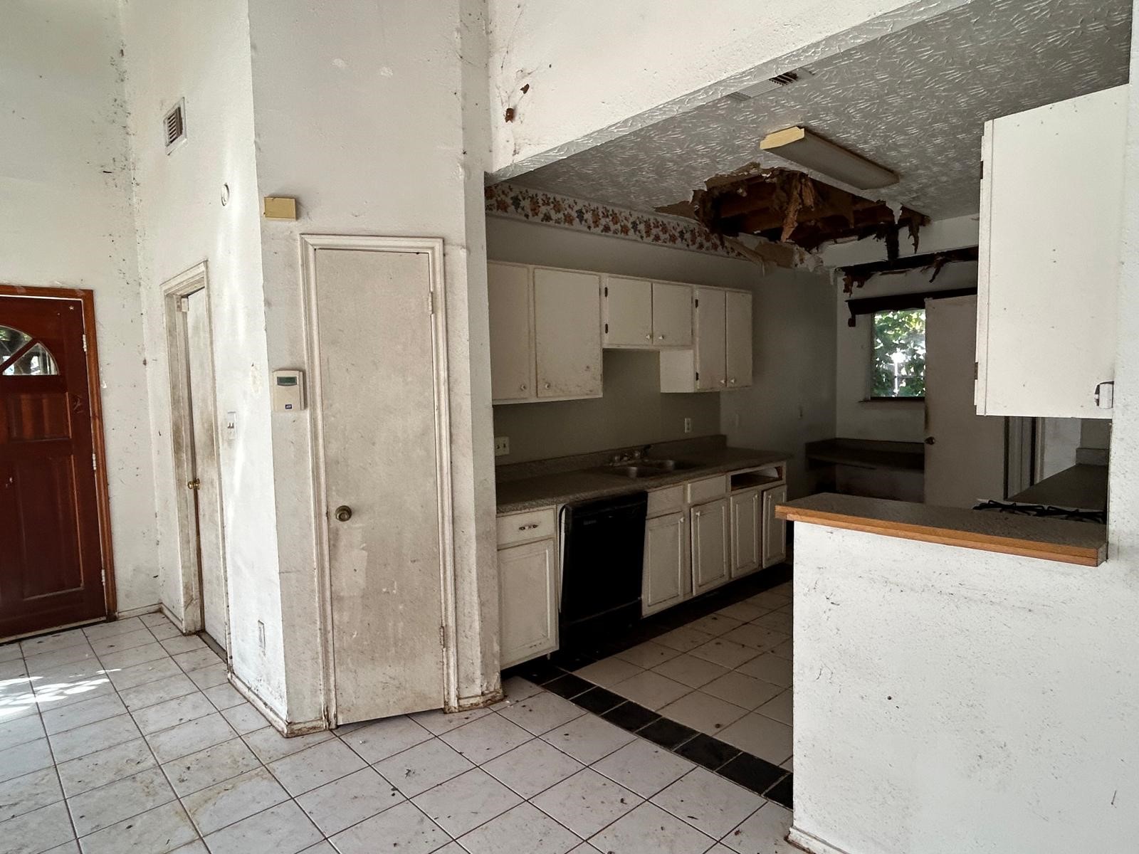 3838 Buckhurst Drive Houston, TX 77066 - Photo 10 of 21 a kitchen with a refrigerator and a stove top oven