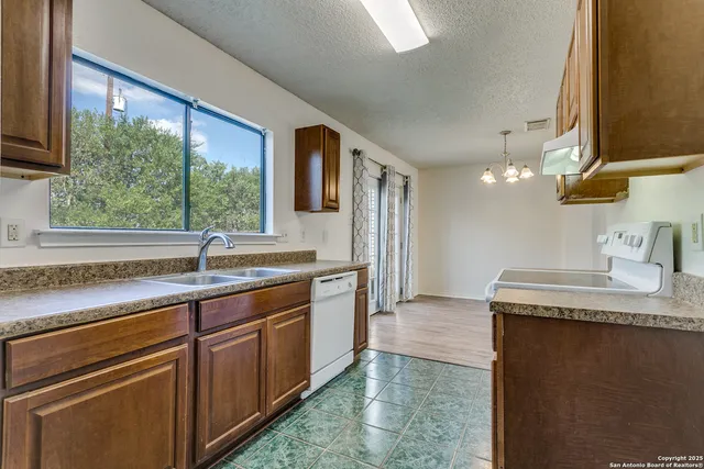 a kitchen with a sink and a window