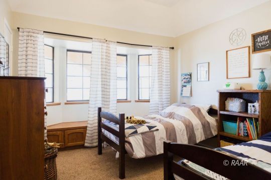 308 North Nolan Street Ridgecrest, CA 93555 - Photo 24 of 35 a bedroom with a bed and a window