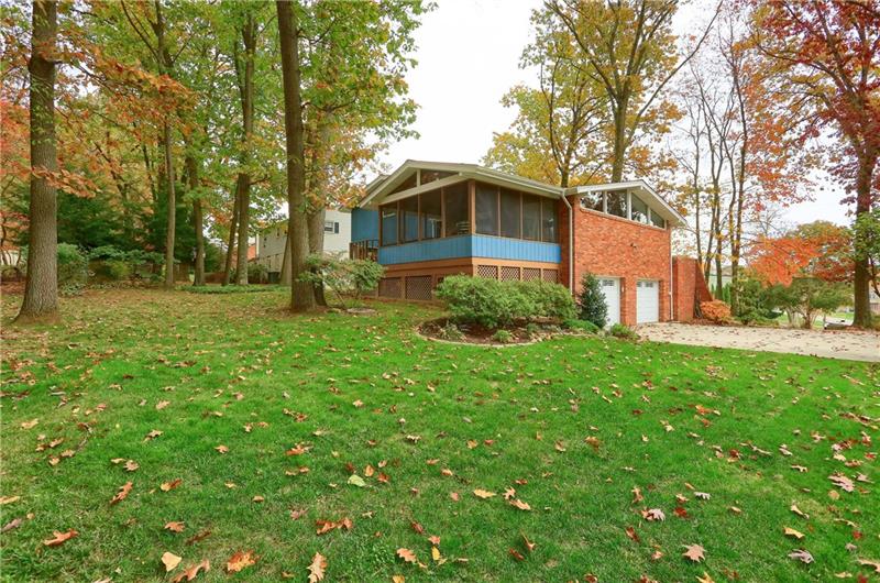 9384 Hilliard Road Pittsburgh, PA 15237 - Photo 25 of 25 Side garage entry and garden bed, and an exterior view of the clearstory windows.