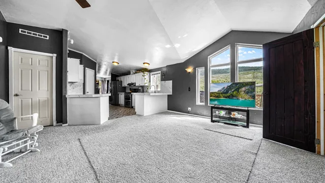 a view of a kitchen with furniture and a window