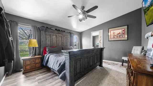 a bed room with a bed and a window