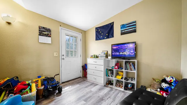 a view of a workspace with furniture and toys