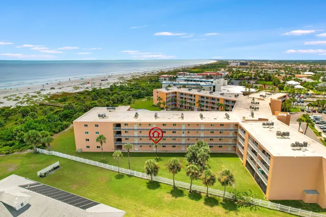an aerial view of a city with lawn chairs