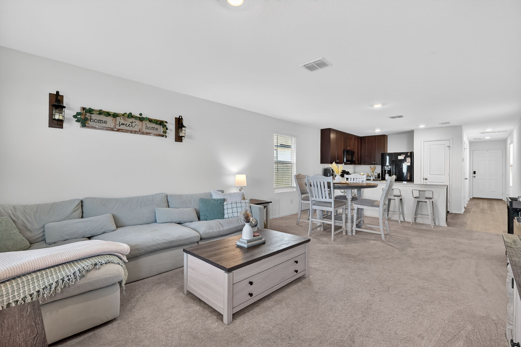 612 Marty Allen Loop Jarrell, TX 76537 - Photo 3 of 15 Living area featuring recessed lighting and light colored carpet