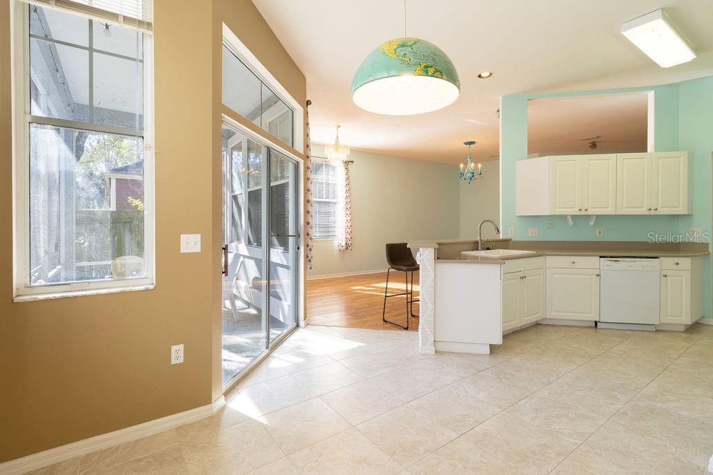 9918 Southwest 52nd Road Gainesville, FL 32608 - Photo 17 of 30 a bathroom with a tub sink and mirror
