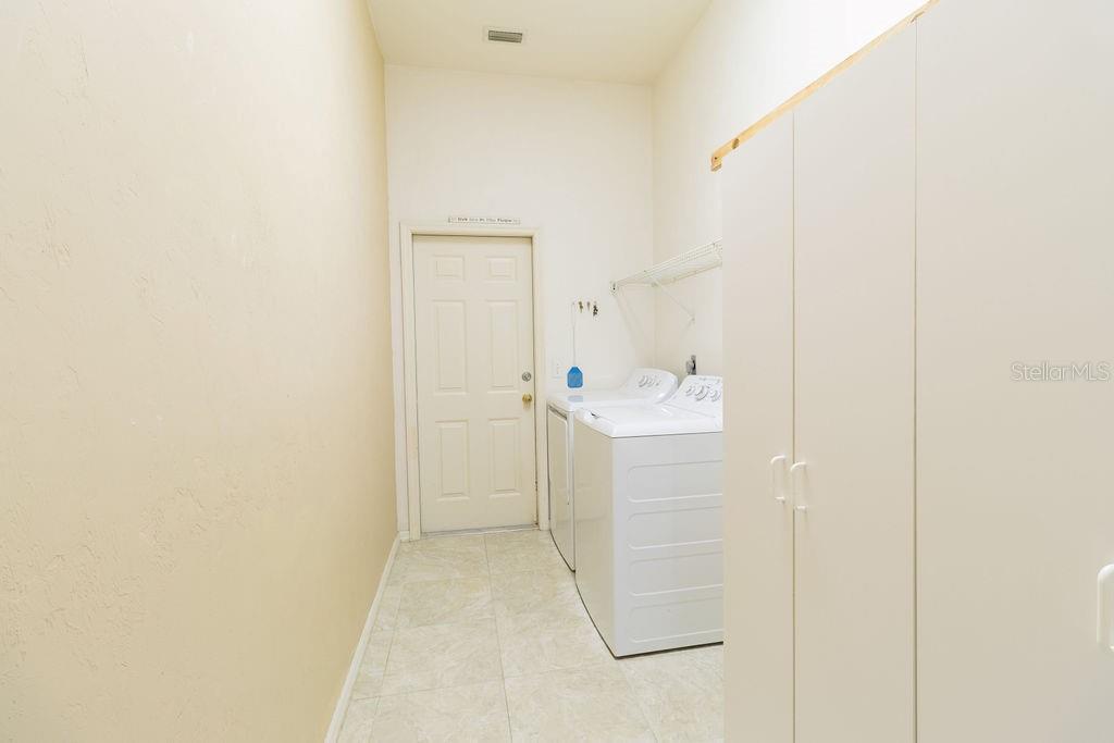 9918 Southwest 52nd Road Gainesville, FL 32608 - Photo 25 of 30 a bathroom with a sink a mirror and shower