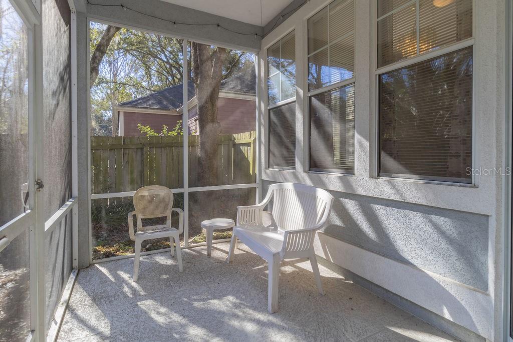 9918 Southwest 52nd Road Gainesville, FL 32608 - Photo 27 of 30 a patio with table and chairs