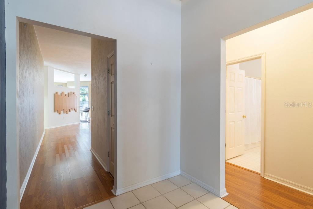 9918 Southwest 52nd Road Gainesville, FL 32608 - Photo 5 of 30 a view of a hallway with wooden floor