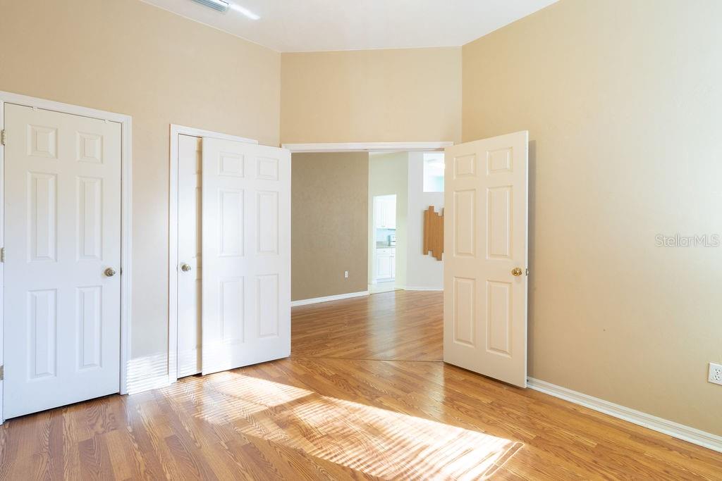 9918 Southwest 52nd Road Gainesville, FL 32608 - Photo 10 of 30 a view of an empty room with wooden floor