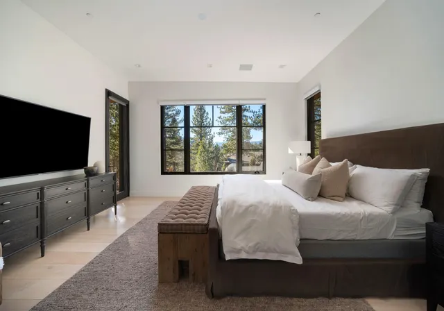 a bathroom with a bathtub and windows