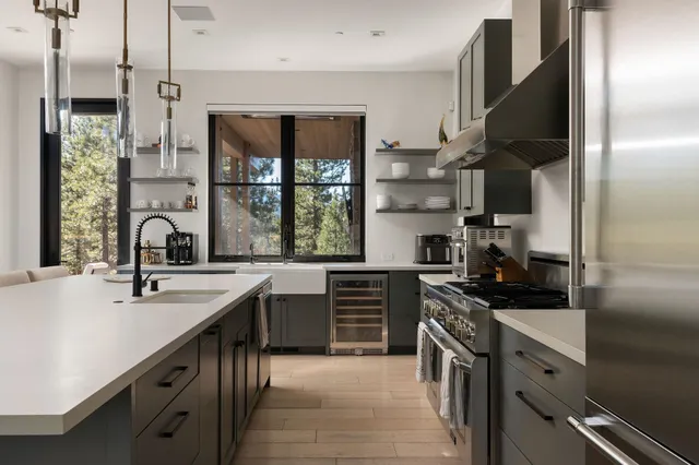 a large kitchen with a table and chairs