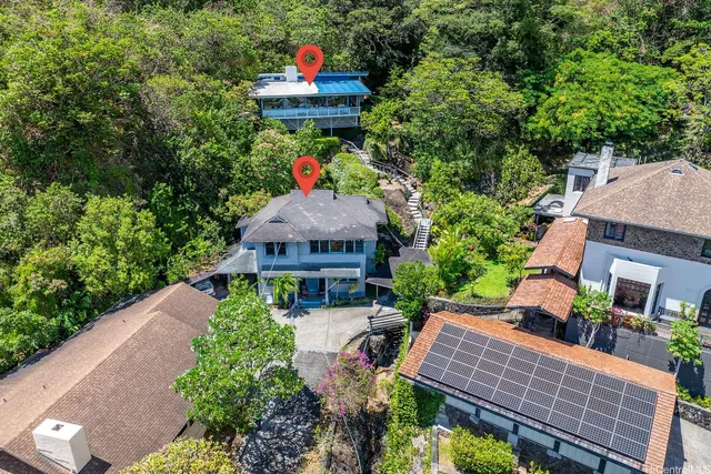 a view of a patio with table and chairs and potted plants