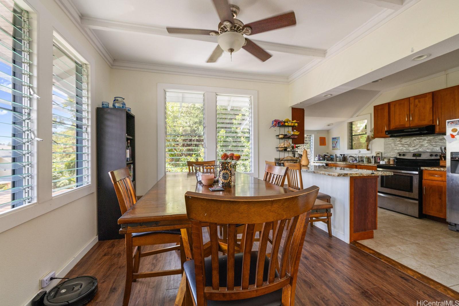 2870 Komaia Place, Unit 2870A AND 2884 Honolulu, HI 96822 - Photo 12 of 25 a dining room with furniture a window and a chandelier