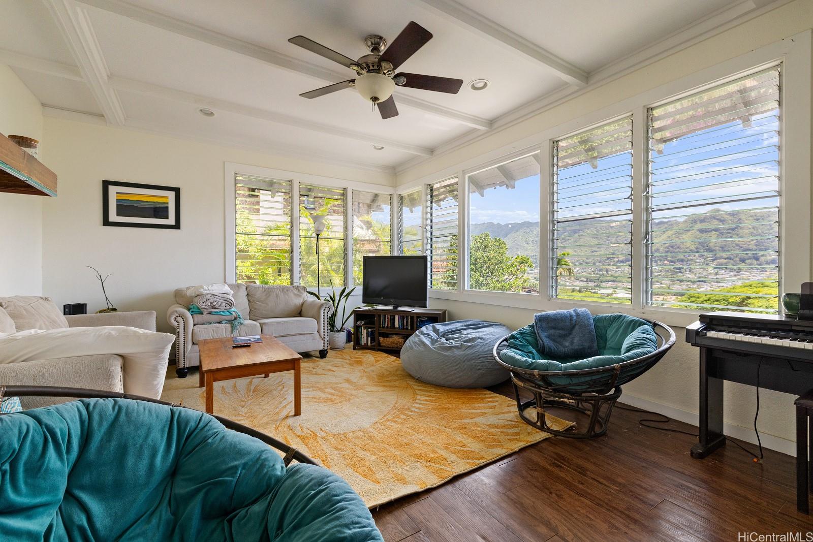 2870 Komaia Place, Unit 2870A AND 2884 Honolulu, HI 96822 - Photo 14 of 25 a living room with furniture a flat screen tv and a large window