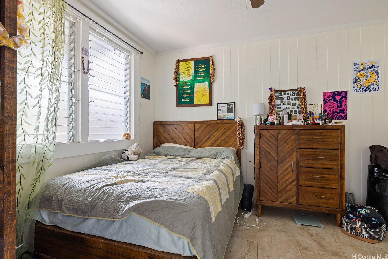 2870 Komaia Place, Unit 2870A AND 2884 Honolulu, HI 96822 - Photo 15 of 25 a bedroom with a bed and a window
