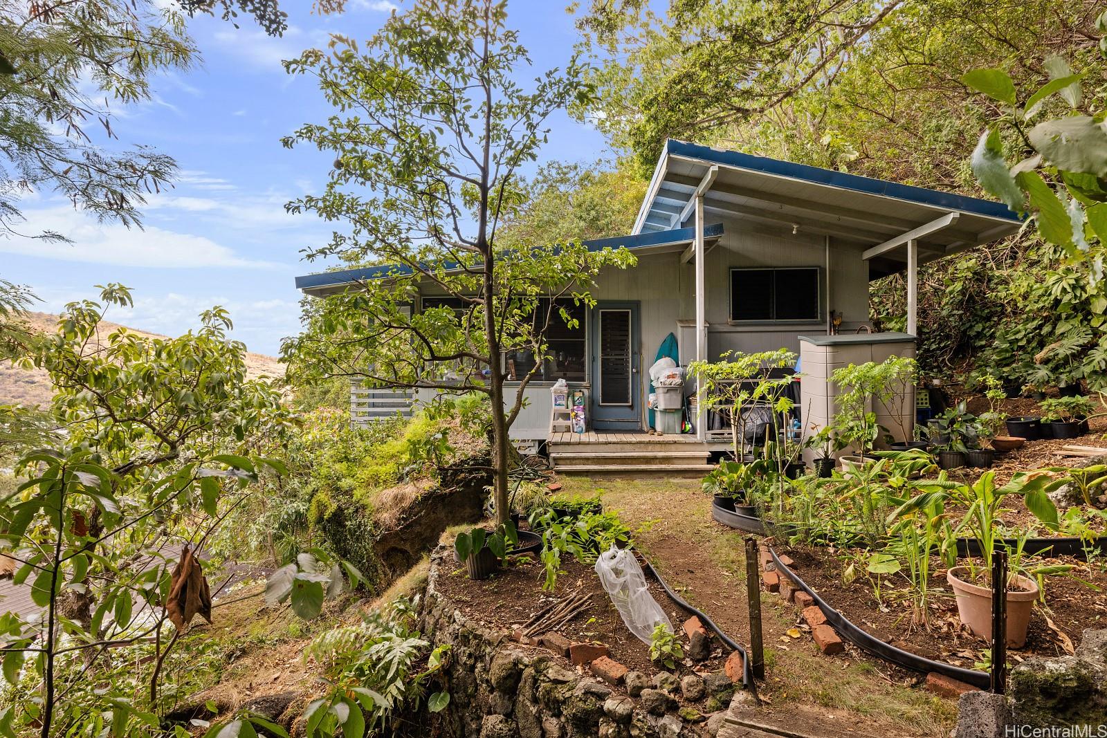 2870 Komaia Place, Unit 2870A AND 2884 Honolulu, HI 96822 - Photo 19 of 25 front view of a house with a yard