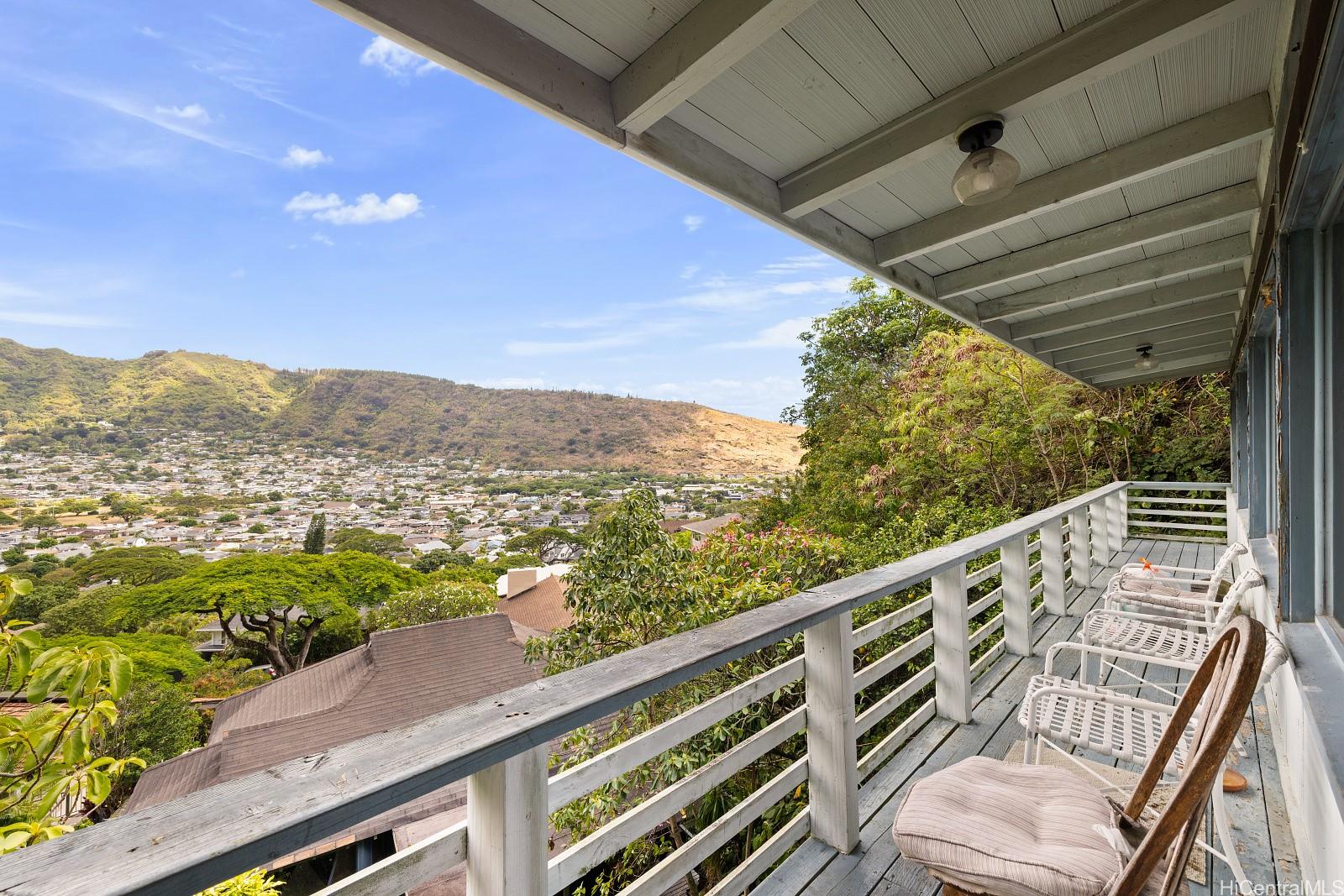 2870 Komaia Place, Unit 2870A AND 2884 Honolulu, HI 96822 - Photo 20 of 25 a view of a balcony with mountain view and wooden floor