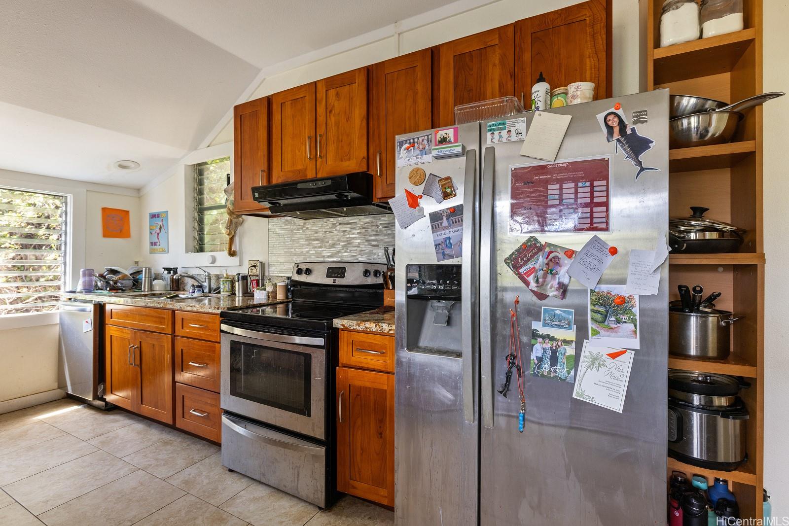 2870 Komaia Place, Unit 2870A AND 2884 Honolulu, HI 96822 - Photo 10 of 25 a kitchen with stainless steel appliances granite countertop a refrigerator and a sink