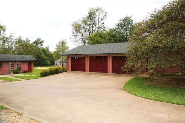 433 West Washington Street Paris, TX 75460 - Photo 12 of 12 a house with trees in the background