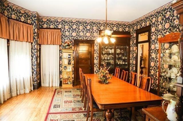 433 West Washington Street Paris, TX 75460 - Photo 9 of 12 a dining room with a table and chairs