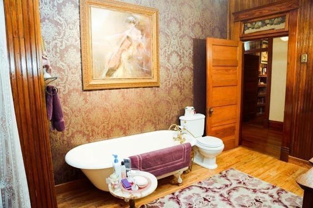 433 West Washington Street Paris, TX 75460 - Photo 10 of 12 a bathroom with a tub and sink