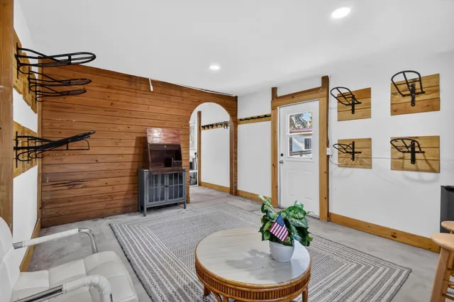 a bedroom with furniture and large window