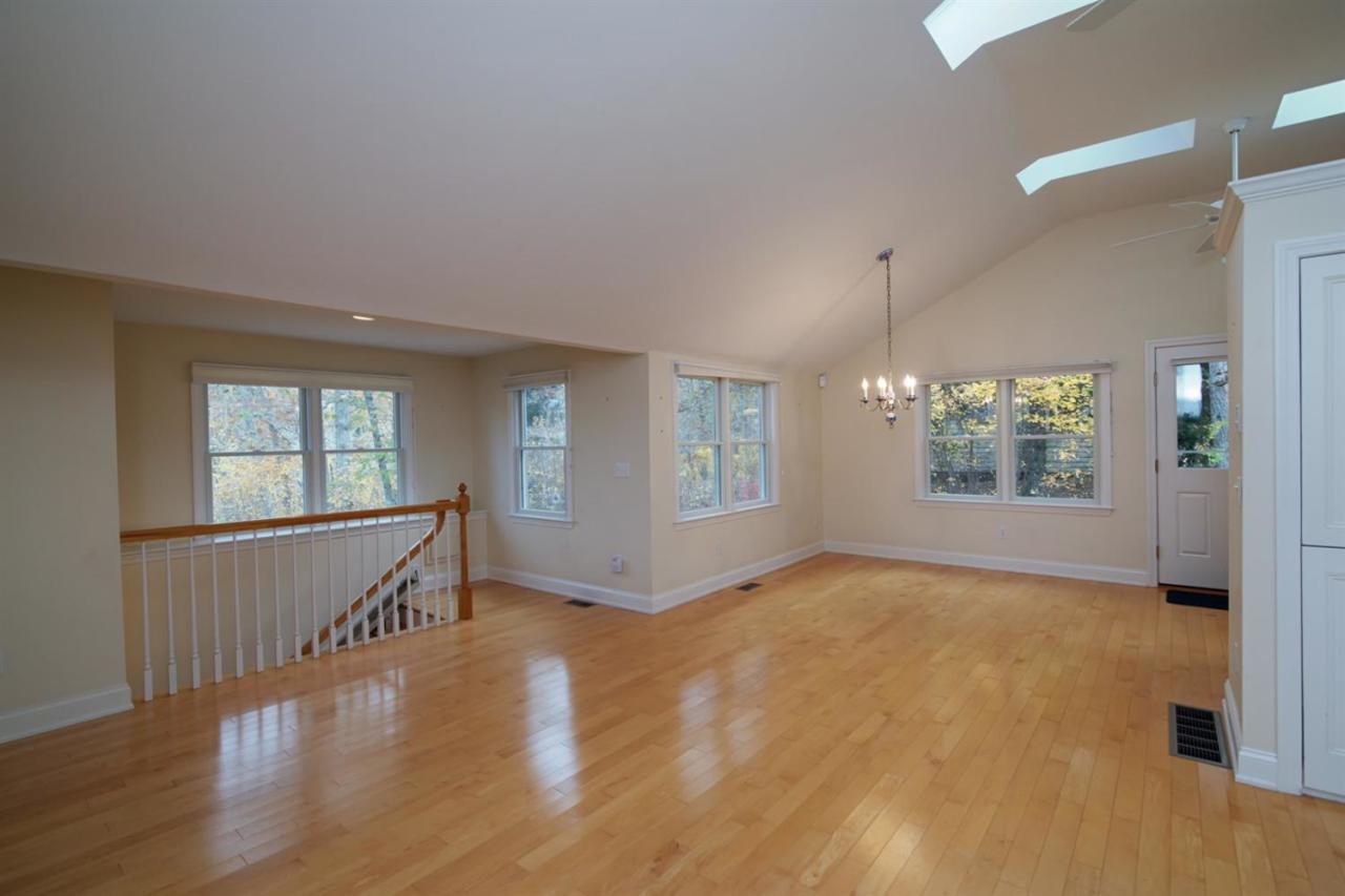 44 Nyes Neck Road Centerville, MA 02632 - Photo 16 of 20 wooden floor in an empty room with a window