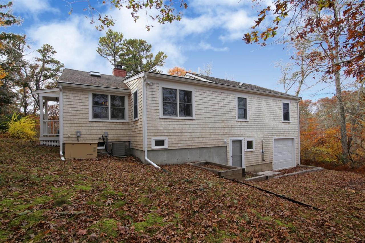 44 Nyes Neck Road Centerville, MA 02632 - Photo 20 of 20 a view of a house with a yard and a tree