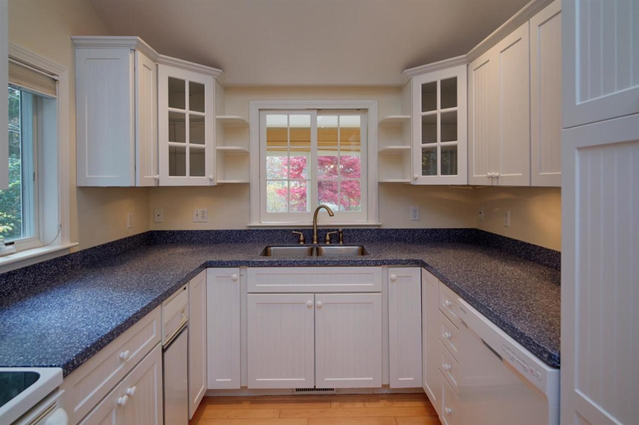 44 Nyes Neck Road Centerville, MA 02632 - Photo 10 of 20 a kitchen with stainless steel appliances granite countertop a sink dishwasher stove and cabinets