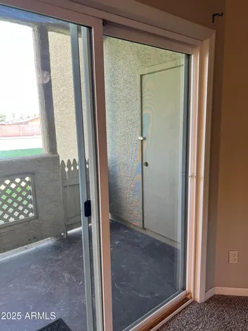 a bathroom with a glass door shower and a sink