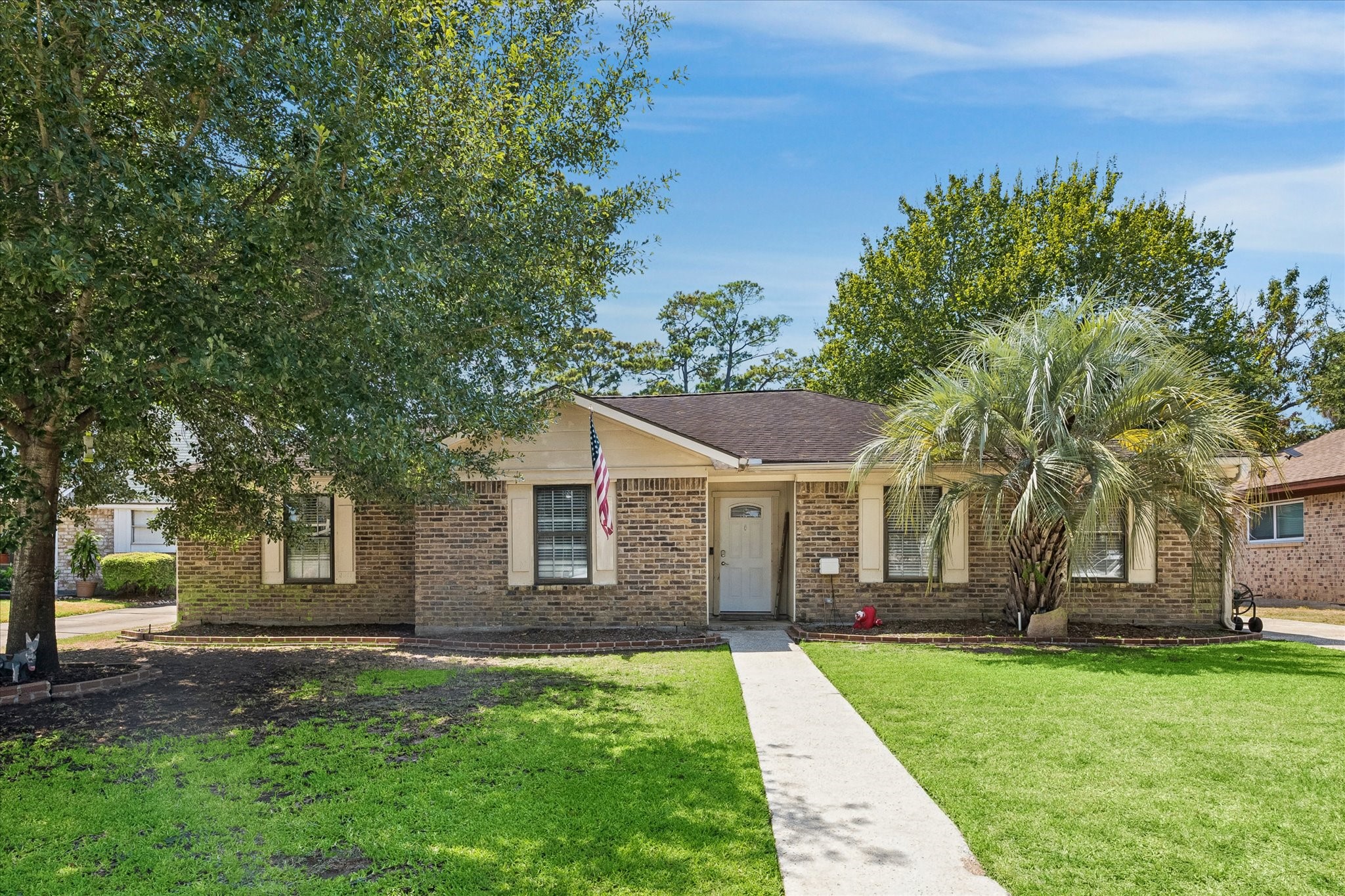 23115 Stepinwolf Lane Spring, TX 77373 - Photo 2 of 18 Charming brick home surrounded by lush greenery and mature trees.